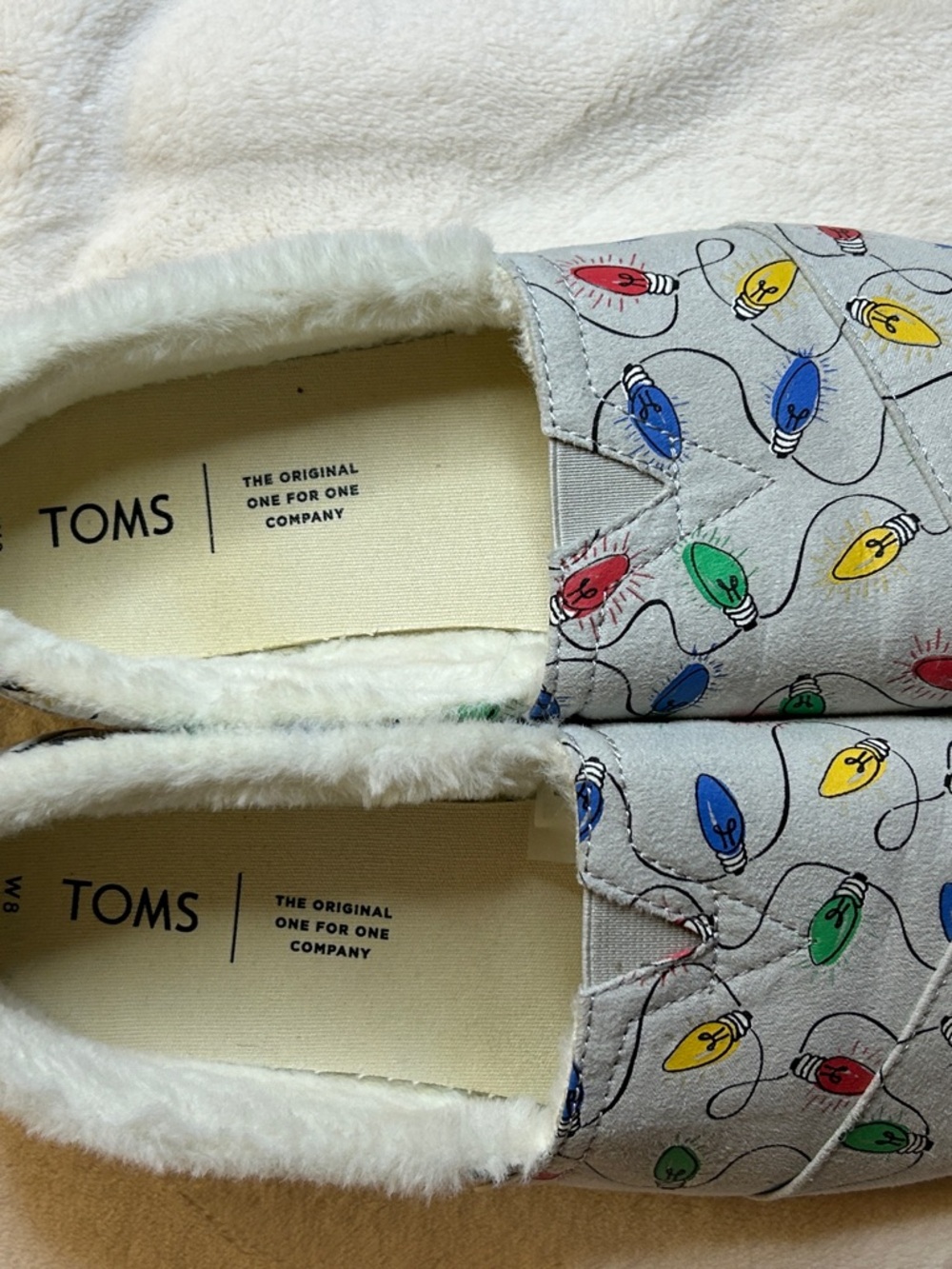TOMS Light Gray Slip-Ons with Multicolor Glow in the Dark Holiday Light Print
